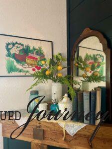 thrifted art styled on a mantel display