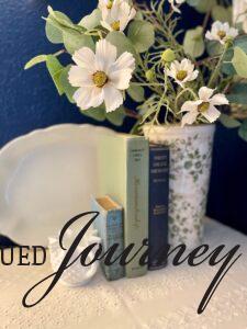 vintage and thrifted decor styled into a bedroom vignette
