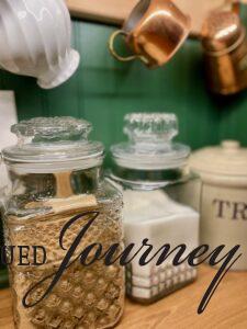 glass jars used for sugar in a kitchen found thrifted for budget home decor ideas