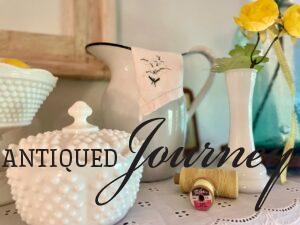 summer shelf decor with vintage and thrifted pieces