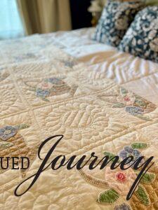 a vintage quilt used as summer bedding for master bedroom decor