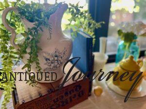 a summer vignette styled with vintage decor 