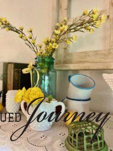 faux greenery used on a summer shelf display