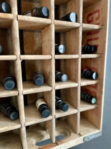a vintage wooden crate used to hold essential oils