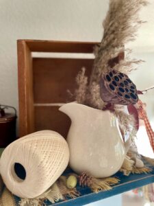 vintage wooden crate styled on a shelf for fall decor