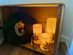 a thrifted vintage crate used as a Thanksgiving vignette 
