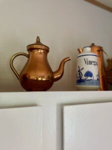 vintage copper teapot styled in a kitchen