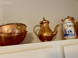 thrifted vintage copper teapot decorated in a kitchen 