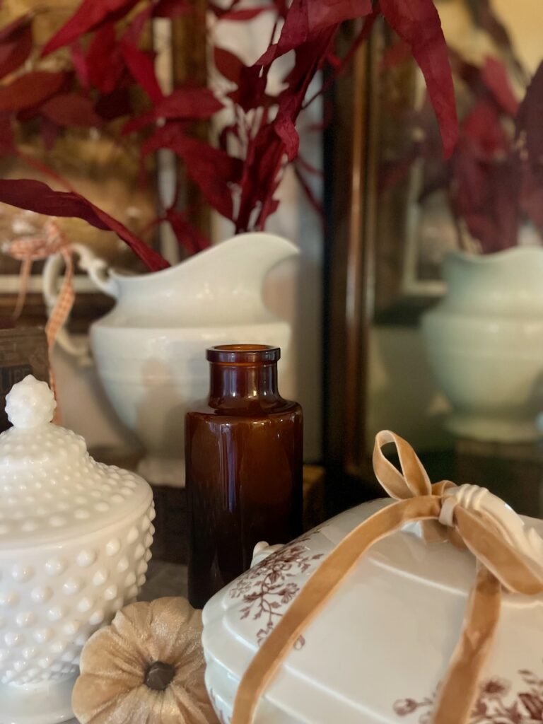 decorating with vintage amber glass bottles for fall decor