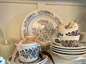 cheap fall decorating with thrifted items in a hutch