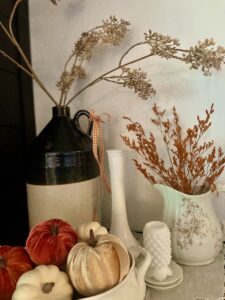 summer to fall decor on a mantel
