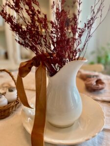vintage ironstone pitcher styled as a table centerpiece for fall
