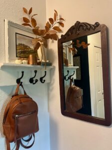 a fall entryway with a mirror