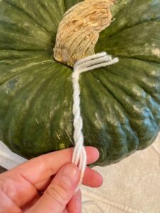 porch pumpkin decor with yarn pumpkin