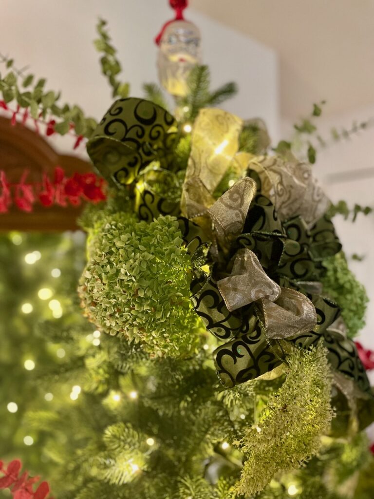 decorating a King of Christmas artificial tree