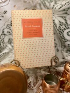 Mastering the Art of French Cooking cookbook hardcover with vintage copper cookware