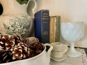 pinecones in a vintage ironstone tureen used for winter decorating