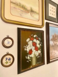 thrifted wall art in a living room