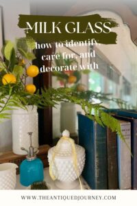 vintage milk glass styled on a mantel with faux greens