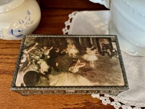 secondhand inherited decor styled in a curio cabinet