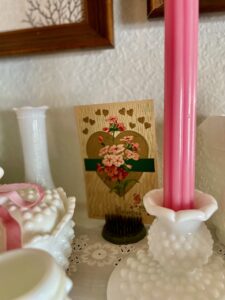 vintage flower frogs displayed on a Valentine decor shelf