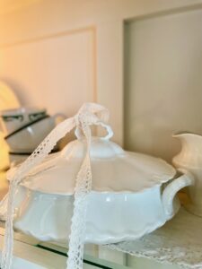 thrifted decor styled in a hutch 