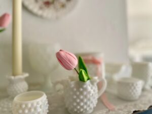 a vintage milk glass display for spring decorating 
