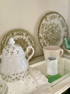 vintage hutch decorated for spring with thrifted transferware 