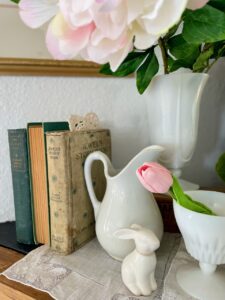 thrift store finds for spring decor styled on a vintage mantel