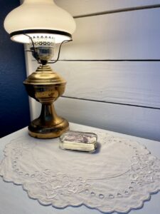 a vintage doily styled on a nightstand