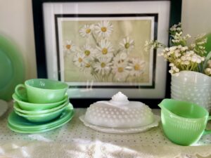 thrifted hutch display featuring jadeite for spring decor