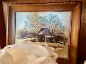 vintage art styled in a vintage curio cabinet for spring 