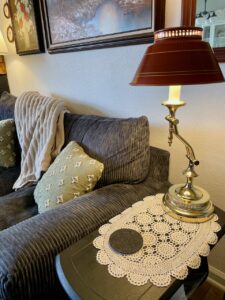 Secondhand living room decor styled to look cohesive and intentional with vintage furniture and art