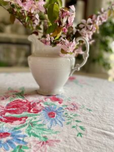 vintage floral tablecloth with fresh flowers styled on a dining table