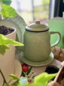 Intentional secondhand shopping curated shelf vignette