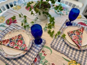 thrifted vintage tablecloth used in a summer table setting