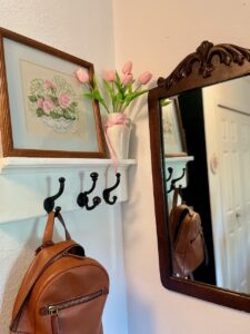 thrifted vintage frame styled in a clutter-free entry for sustainable thrifting