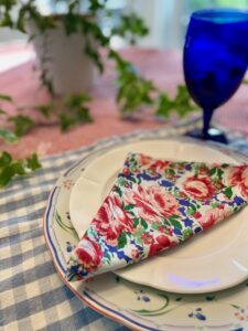close-up of a vintage cloth napkin corner showing fabric texture and hemstitch detail