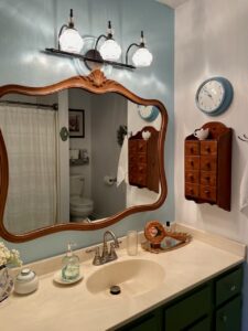 builder grade bathroom styled with vintage decor