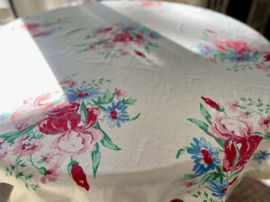 vintage floral linen tablecloth styled in the sun for spring