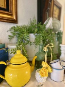 Blue, white, and yellow summer mantel decor styled with thrifted vintage finds