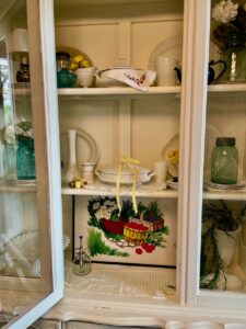 full summer hutch display with vintage and thrifted finds