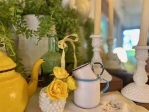 vintage, thrifted glass jars styled on a vintage mantel summer vignette