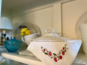 vintage hankies and linens used in a summer hutch display