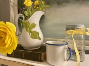 vintage decor styled on a bathroom shelf for summer decorating
