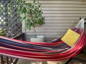 linen hammock used on a small patio for summer