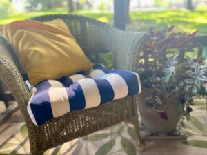 thrifted wicker chair for seating on a small patio