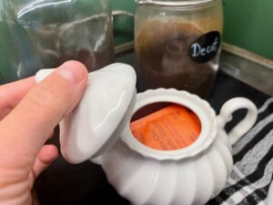 a vintage sugar dish used to hold tea in a vintage kitchen
