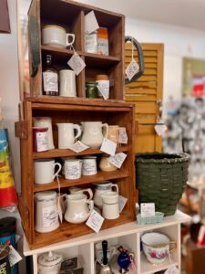 collections of creamers shopping at an antique store for decor