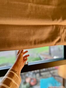 new linen Roman shades in a vintage-inspired home